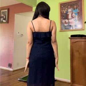 A dark beautiful blue dress with sparkles that make you shine